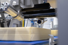 A cheese is scanned by multiple cameras for vision control